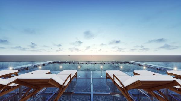Onsen pool with ocean infinity view on hotel rooftop